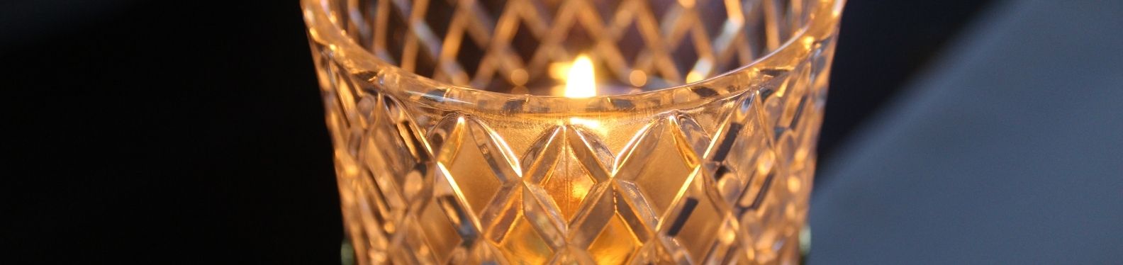 Photo of an altar candle lit, zoomed in.