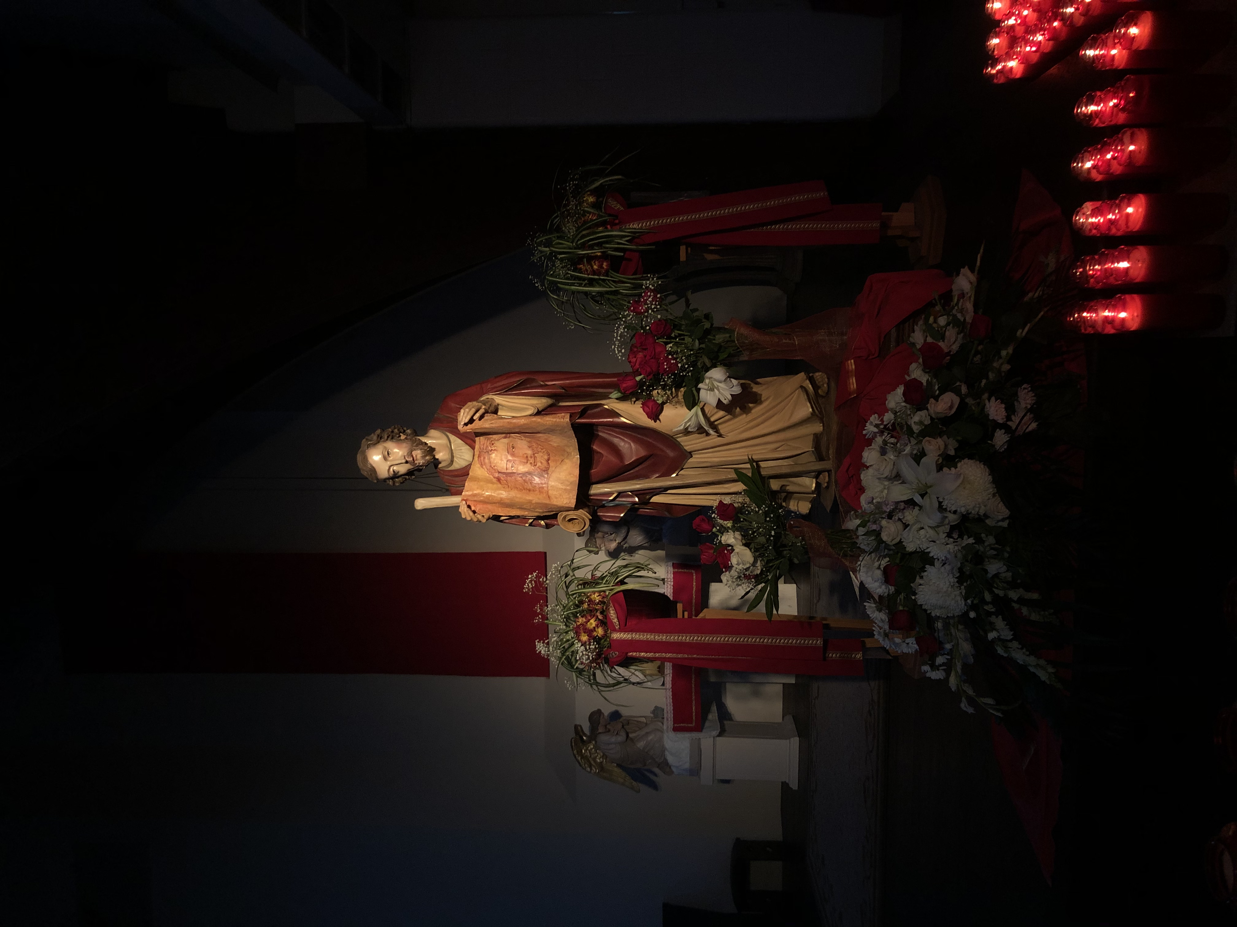 Photo of a St. Jude's statue in the sanctuary,  St. Jude is holding a cloth with Christ's face.